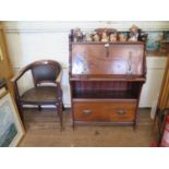 An Edwardian Art Nouveau style mahogany bureau, the fall front enclosing a fitted interior, over a