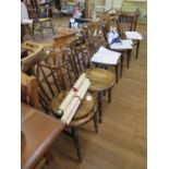 A set of four spindle back kitchen chairs with ring turned legs joined by stretchers and another