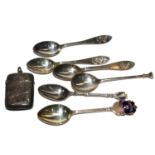 A collection of four silver and two EPNS coffee spoons together with a silver vesta case