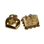 Two 18 carat gold charms ? a Swiss chalet and a cow bell