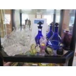 A pair of cobalt blue ships decanters, a claret jug, Wedgwood paperweight and other glasswares