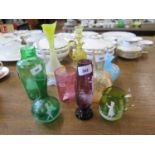 Four Mary Gregory style coloured glass vases and a beaker, each decorated with a child, a yellow