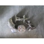 Four miniature silver colour items to include windmill pill box, decorated cog and a teddy bear