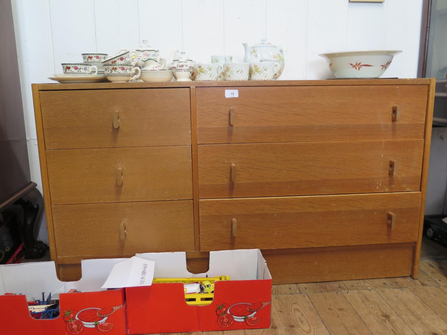 A light oak Stag Furniture chest of drawers, the three short drawers beside three long drawers on