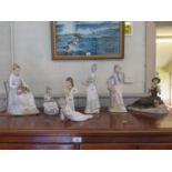 A collection of seven Spanish porcelain figurines from various factories
