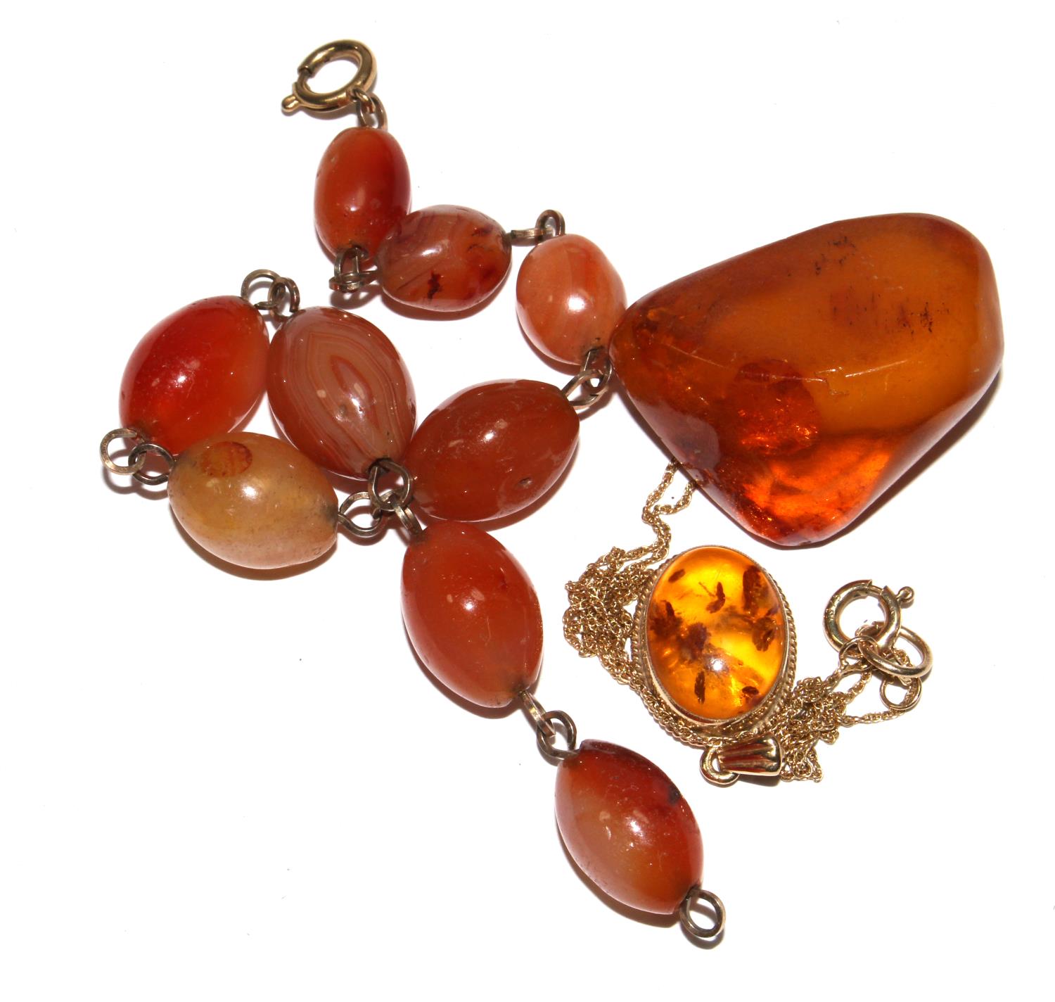A small collection of amber to include bracelet, pendant, etc