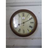 An early 20th century mahogany cased wall clock, the circular painted dial with Roman Numerals,