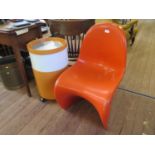 A Vernon Panton style S-shape stacking chair in orange, no maker's marks, and a 1970s orange and