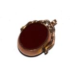 A 9 carat gold spinning fob set with carnelian and onyx