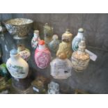 A collection of eleven mixed Chinese snuff bottles, all of different marteials