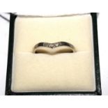 A diamond set white colour metal wish bone ring