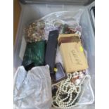 A large plastic box of costume jewellery