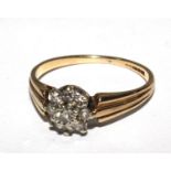 A small diamond cluster ring set in 9 carat gold
