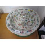 A Chinese famille rose bowl, the all over design with vases, stands and floral sprays, unmarked,