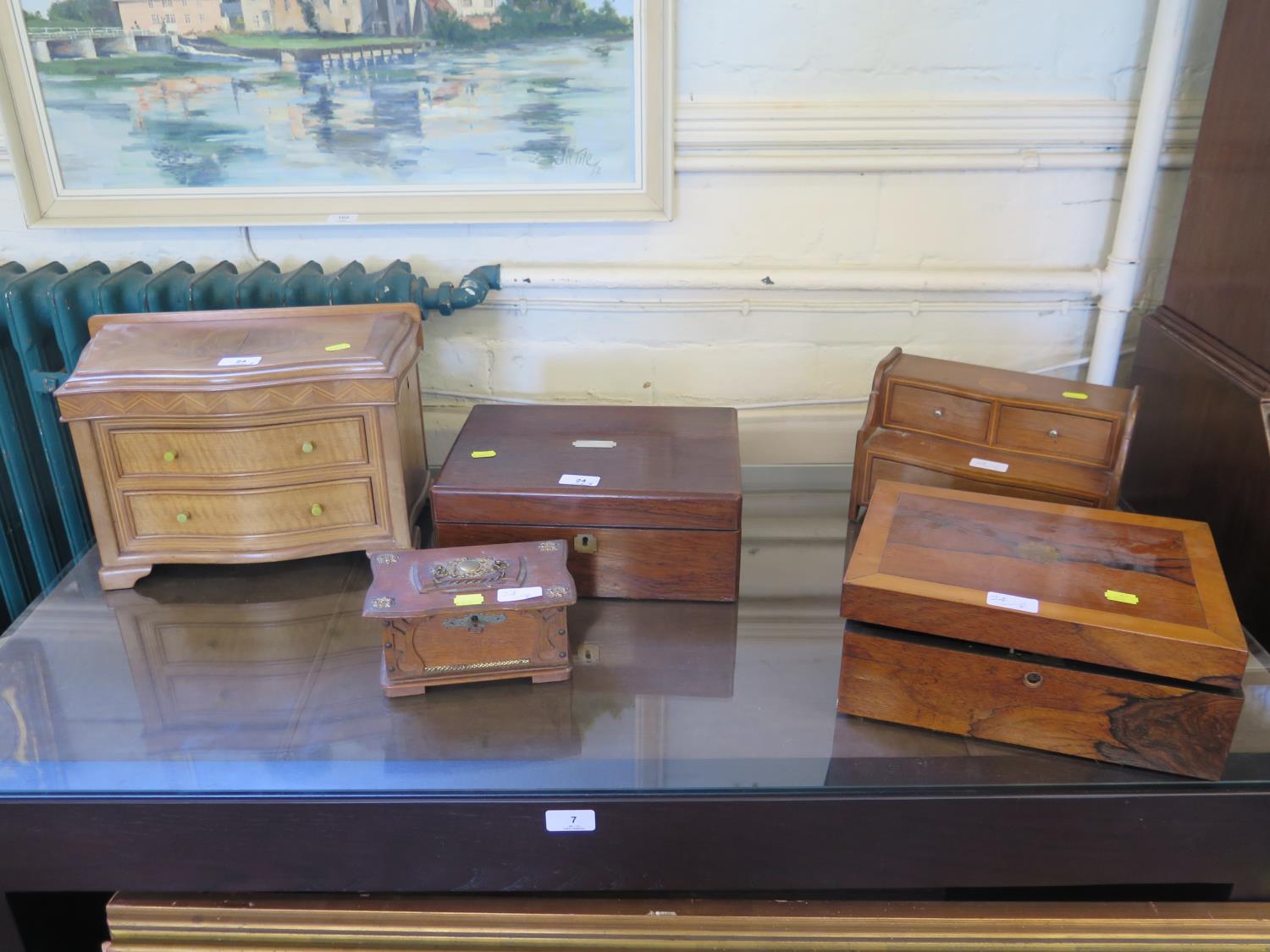 A Victorian rosewood sewing box, 31 cm wide, two other boxes and two miniature chests of drawers (5)