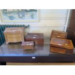 A Victorian rosewood sewing box, 31 cm wide, two other boxes and two miniature chests of drawers (5)