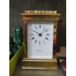 A gilt brass carriage timepiece clock, of conventional form with enamel dial inscribed Eurotime,