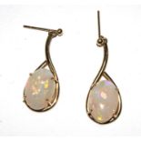 A pair of large opal earrings