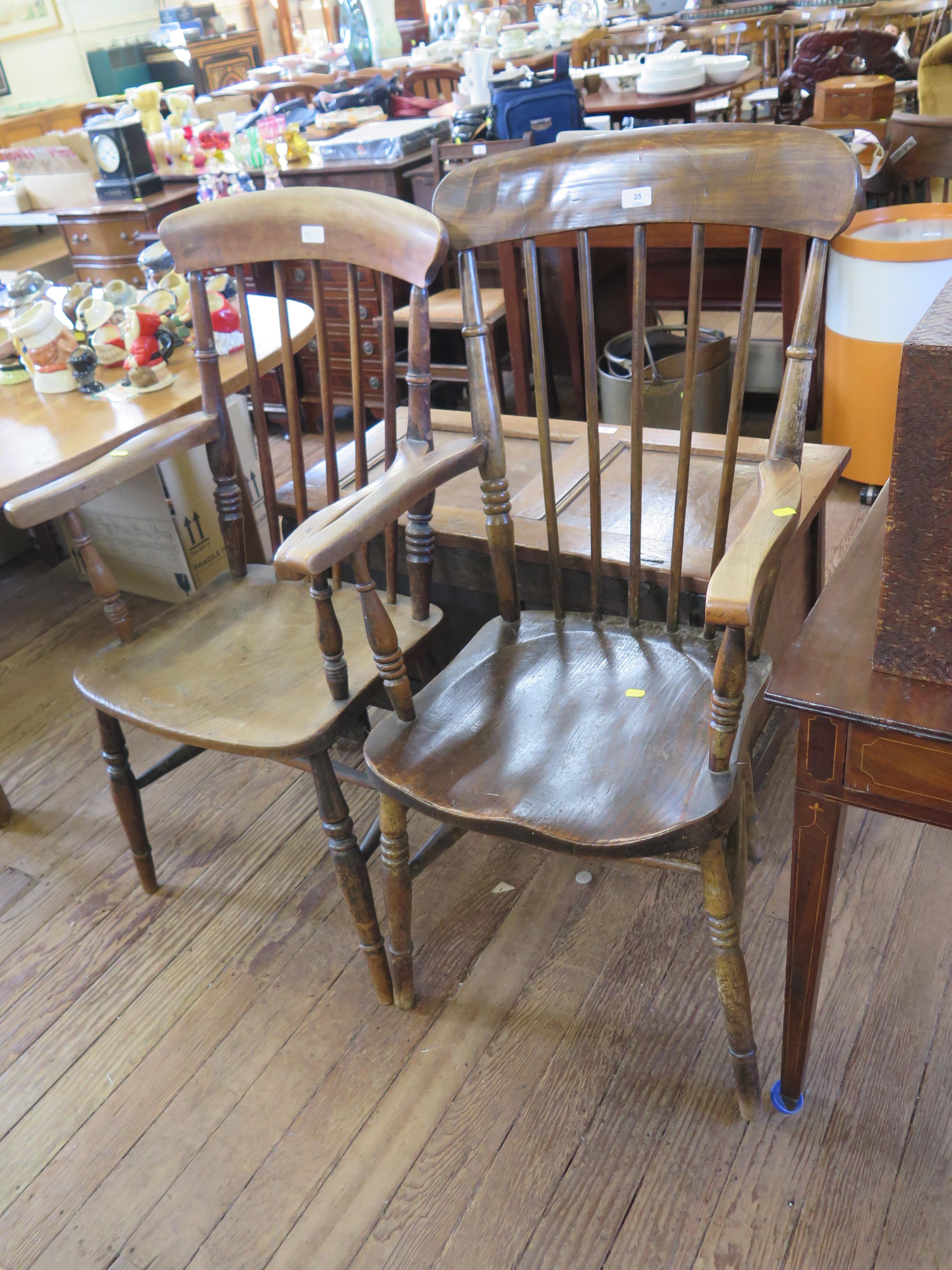 Two ash and elm kitchen armchairs, with spindle backs, moulded seats and ring turned legs, one