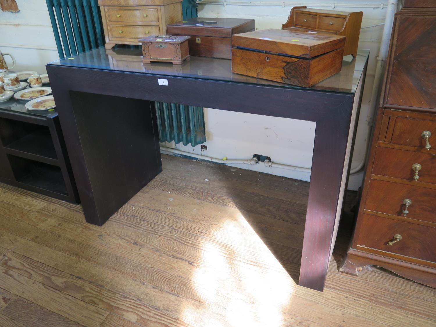 A Rebecca Scott ebony finish and suede console table, 120 cm wide, 60 cm deep, 83 cm high