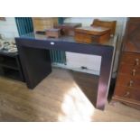 A Rebecca Scott ebony finish and suede console table, 120 cm wide, 60 cm deep, 83 cm high