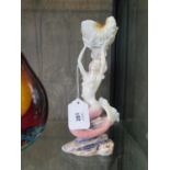 A Unicorn Studio porcelain figure of a mermaid holding a large shell, 24 cm high