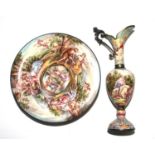 An enamel miniature ewer and a plate, possibly Viennese, depicting Classical figures, plate 11.5