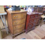 Two small reproduction chests of drawers, a cupboard in the form of a chest and an oak side chair (
