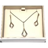 A Kit Heath boxed set of silver necklace and matching earrings