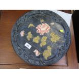 A Bretby Art Pottery Lignum ware hanging plate, depicting pink chrysanthemums on a timber background