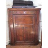 An elm corner cabinet with panelled door, 92 cm wide, 108 cm high