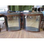 A pair of late Victorian mahogany bowfront hanging cabinets, one with insert for Evans, Sons & Co.