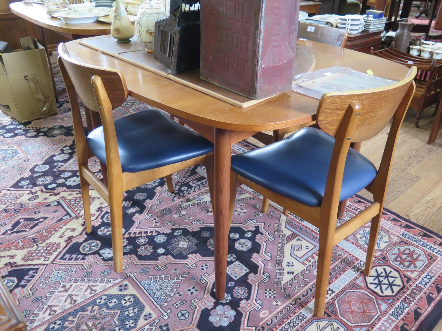 A G-Plan style teak extending dining table, with integrated hinged leaf, 99 cm wide, and a set of