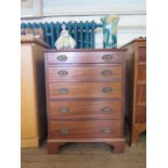 A small 19th century style mahogany chest of drawers, with five graduated drawers on bracket feet,