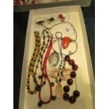 A selection of necklaces and earrings: semi-precious stones and shells including jasper, black onyx,