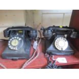 Two vintage black G.P.O. telephones, both with drawers and rotating dials (2)