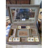 An Anglo Indian ivory and inlaid carved sewing box, depicting birds, dogs and rosettes, enclosing