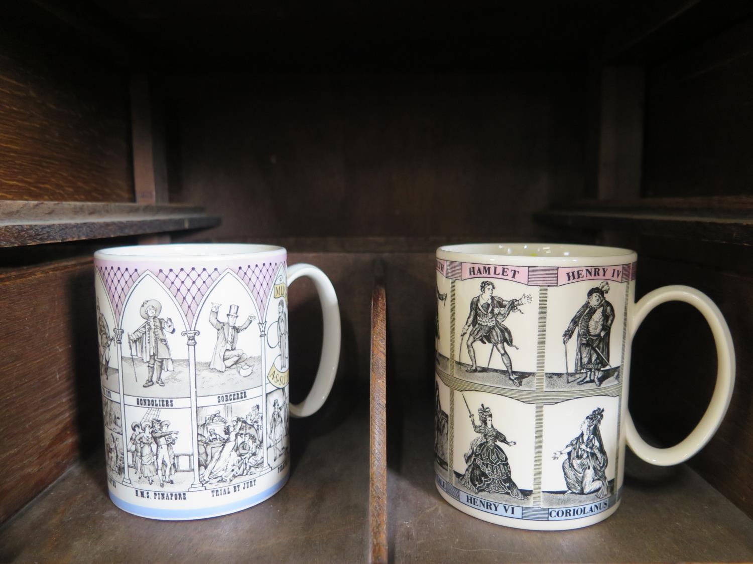 Two Wedgwood mugs commemorating Gilbert and Sullivan operas and William Shakespeare