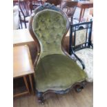 A mid Victorian walnut nursing chair, the button upholstered waisted back over a shaped seat and