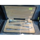 A silver handled glove stretcher, shoe horn and button hook in original fitted case