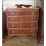 A George III style crossbanded mahogany chest of drawers, with brush slide and four graduated