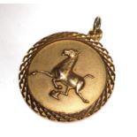A 9 carat gold pendant of a running horse