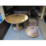 Four various treen items including a cake stand, trinket bowl and puzzle box