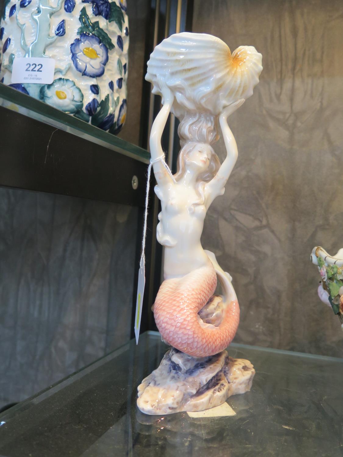 A Unicorn Studio porcelain figure of a mermaid holding a large shell, 24 cm high