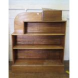 A mahogany open bookcase, with raised back and plinth base, 97 cm wide, 27 cm deep, 109 cm high