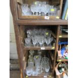 Four glass decanters, two carafes and a jug, and a collection of drinking glasses (three trays)