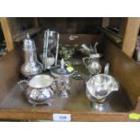 A collection of silver plate to include a sugar shaker, sauce boat on single foot, photo frame and