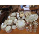 A Noritake dinner and breakfast service, for twelve place settings, a Viennese style cabinet