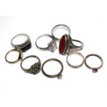 A collection of eight rings to include a large silver and carnelian ring