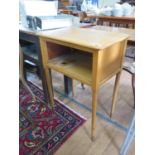 A mahogany coffee table, rectangular with turned and block legs, two side tables with open